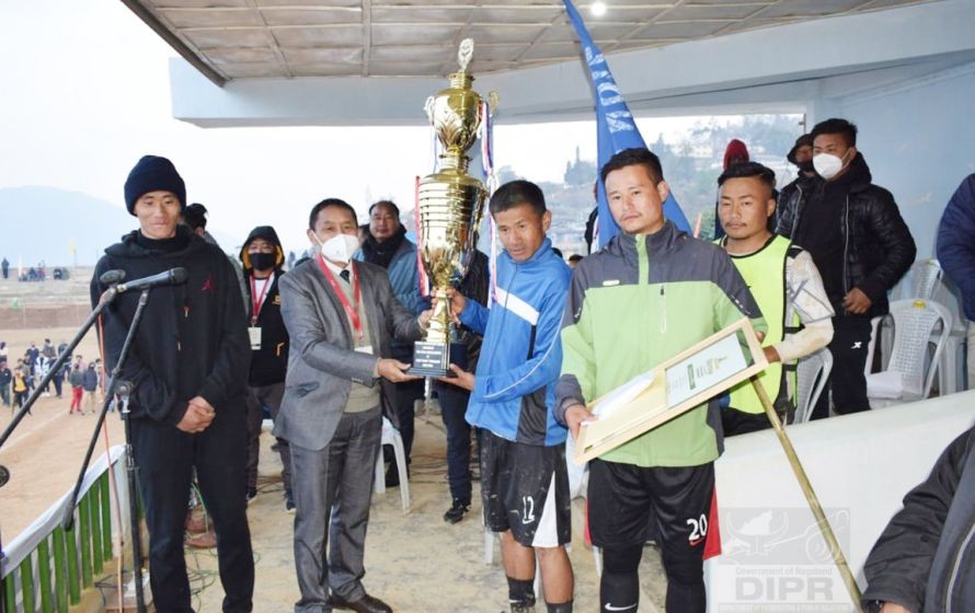 Zion Ward collects the Mini Hornbill Sükrünye-cum-Inter-ward Football Trophy DRDA Project Director, Razukhru Vasa at Phek Local Ground on January 21. (DIPR Photo)